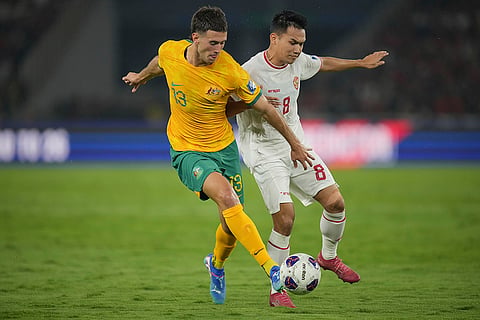 2026 FIFA World Cup Qualifying, Indonesia Australia: Indonesia's Witan Sulaeman, right, battles for the ball against Australia's Alessandro Circati 